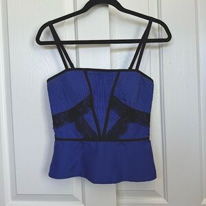 Bebe corset top, beautiful lace trims. Side zipper. Adjustable straps.